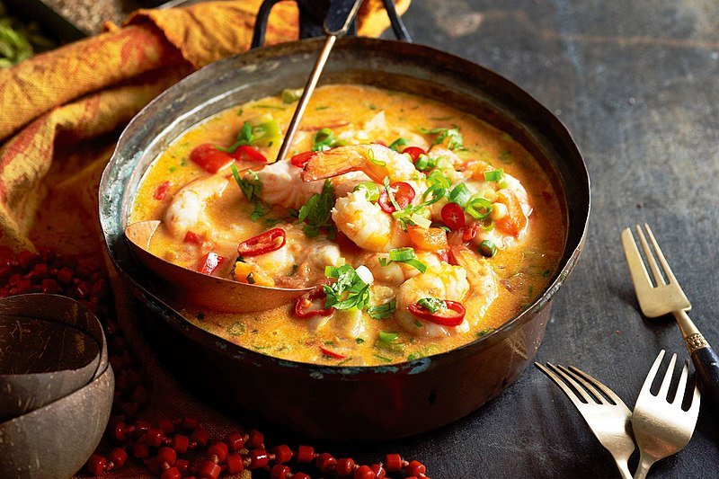 Moqueca de Peixe - Source: WikiCommons.</p>
<p>A bowl with Moqueca de Peixe, a Brazilian stew, served at a table. Shrimps are visible among the freshly made pureé, along with different chopped onions and peppers.</p>
<p>Best Country To Visit In South America